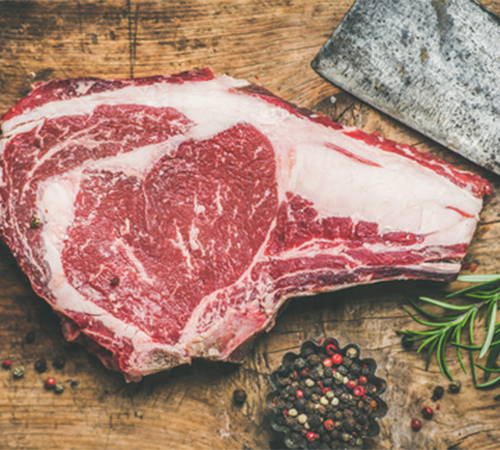 Fresh ribsteak on wooden board